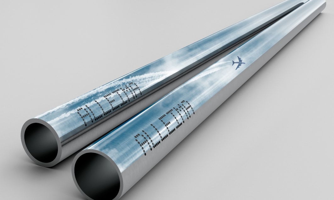 a pair of metal pipes with words and a plane on the side
