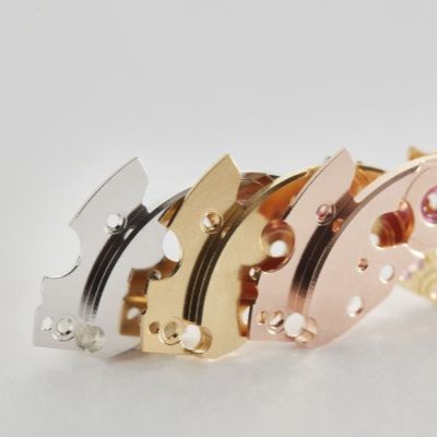 several metal pieces of different colors