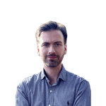 a person with a beard and mustache wearing a checkered shirt
