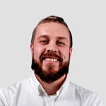 a person with a beard smiling