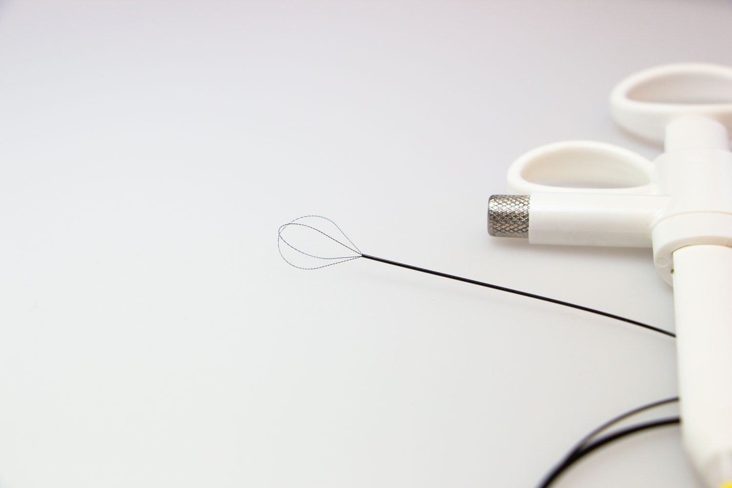a needle and scissors on a table