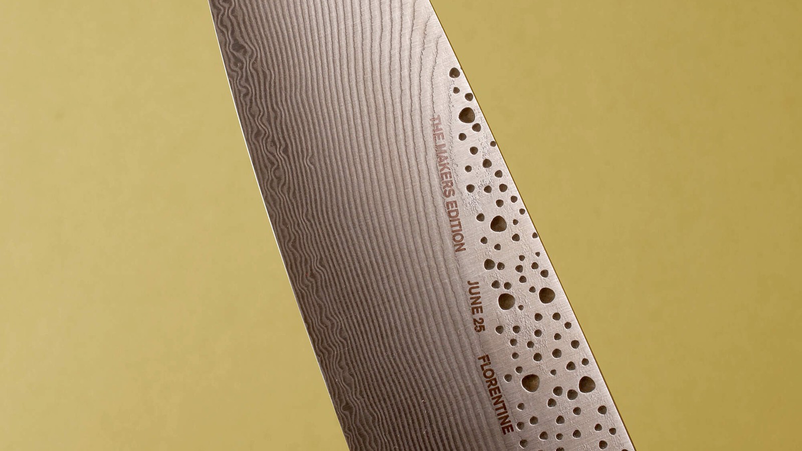 a knife with holes on the blade