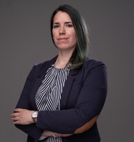 a person with green hair wearing a suit and striped shirt