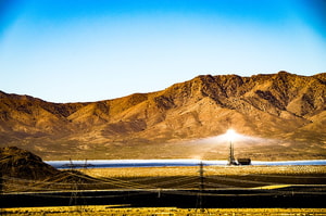 a large field with a light on it