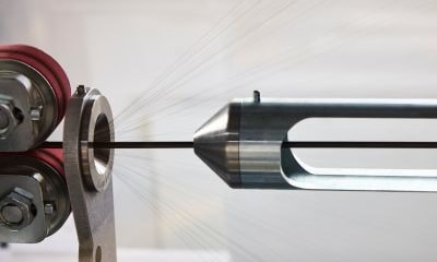 Alleima nitinol wire being processed on a machine
