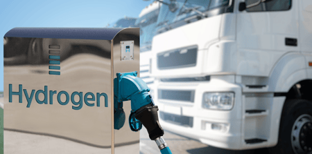 a blue fuel nozzle at a gas station