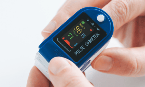 a person using a pulse oximeter