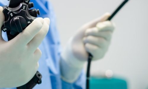 a doctor holding a device