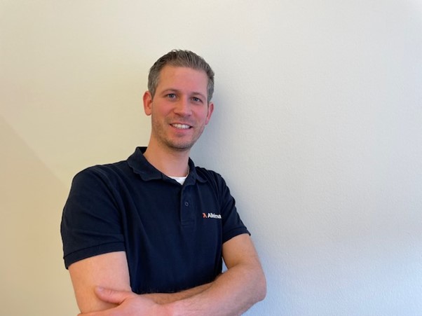 a person standing with his arms crossed