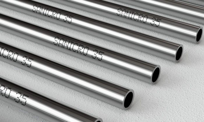 several metal pipes with writing on them