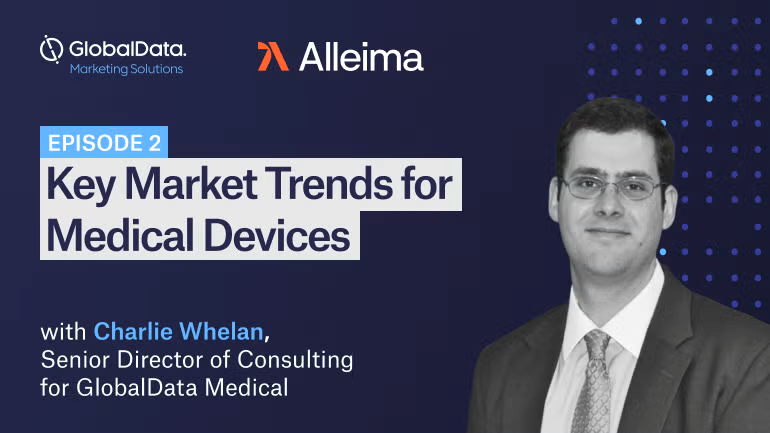 en person i kostym och slips